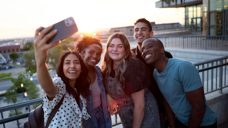 Young Adults at the Conference Center in Salt Lake City are pausing for a selfie. 